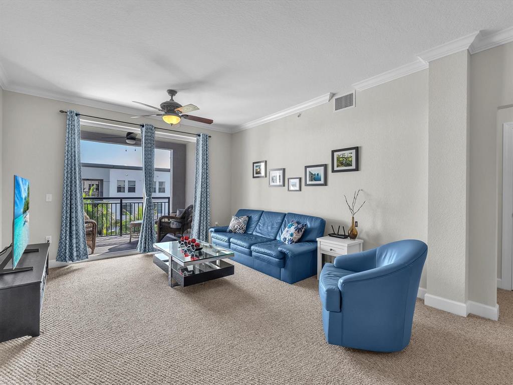 1660 Renaissance Commons Boulevard, Unit 2628 Boynton Beach, FL 33426 - Photo 26 of 49 a living room with furniture and large windows