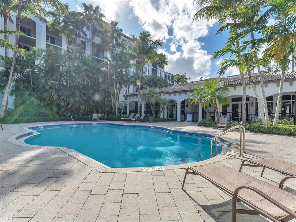 1660 Renaissance Commons Boulevard, Unit 2628 Boynton Beach, FL 33426 - Photo 33 of 49 a view of a swimming pool with a patio