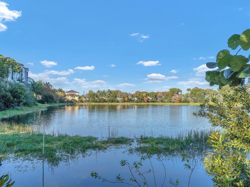 1660 Renaissance Commons Boulevard, Unit 2628 Boynton Beach, FL 33426 - Photo 39 of 49 a view of a lake in between two chairs