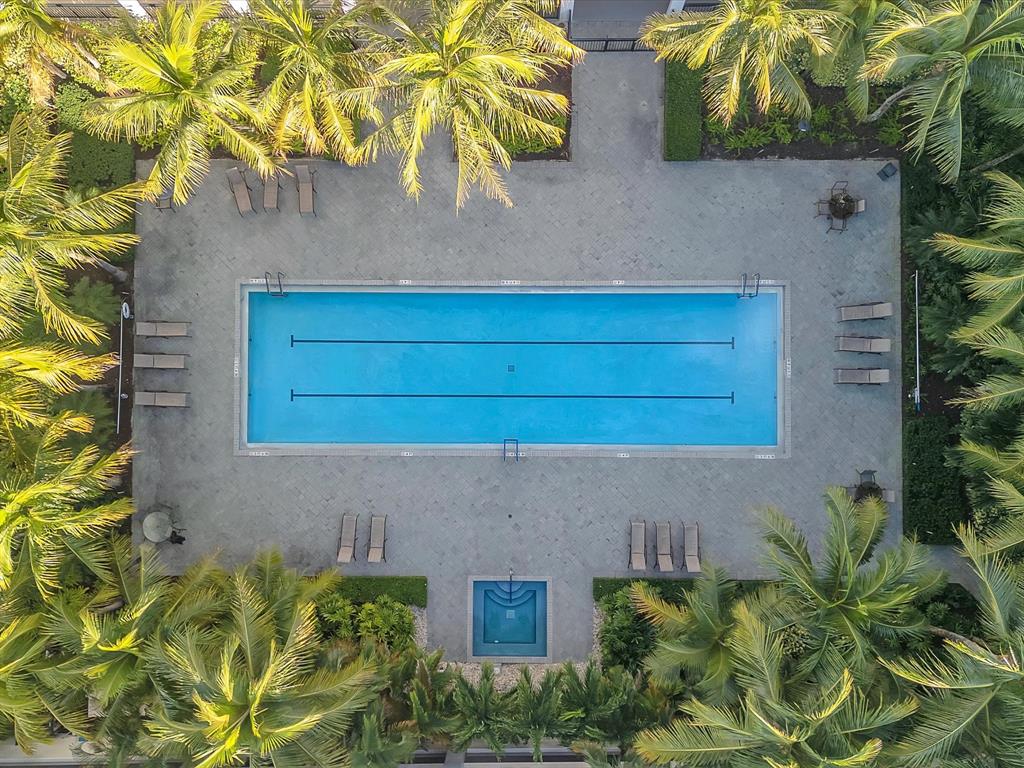 1660 Renaissance Commons Boulevard, Unit 2628 Boynton Beach, FL 33426 - Photo 42 of 49 a potted plant sitting on the side of a brick house