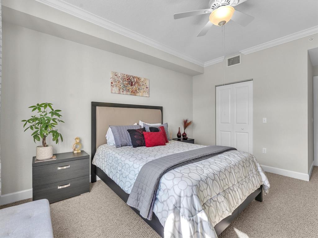 1660 Renaissance Commons Boulevard, Unit 2628 Boynton Beach, FL 33426 - Photo 10 of 49 a bedroom with a bed and a potted plant