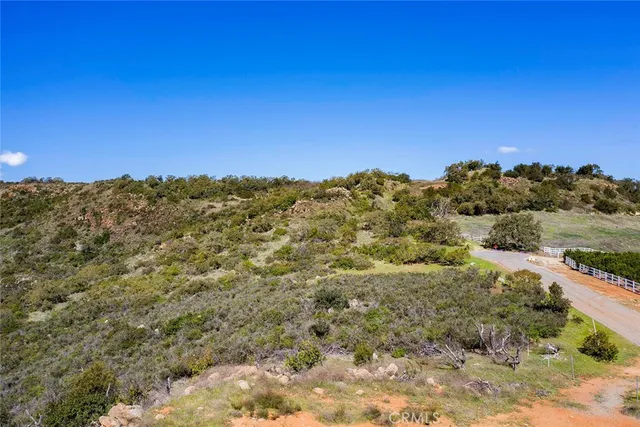 a view of a field with an ocean