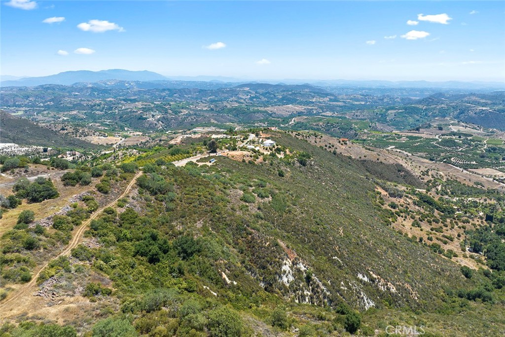 15 Vía Escalon Temecula, CA 92590 - Photo 7 of 42 an aerial view of residential houses with city view