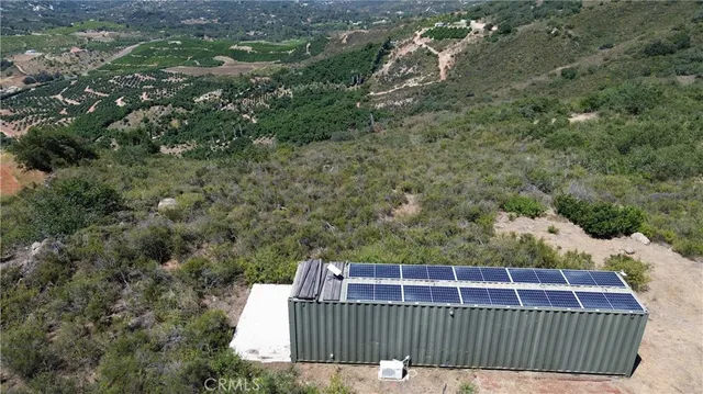 a view of a roof deck with wooden fence