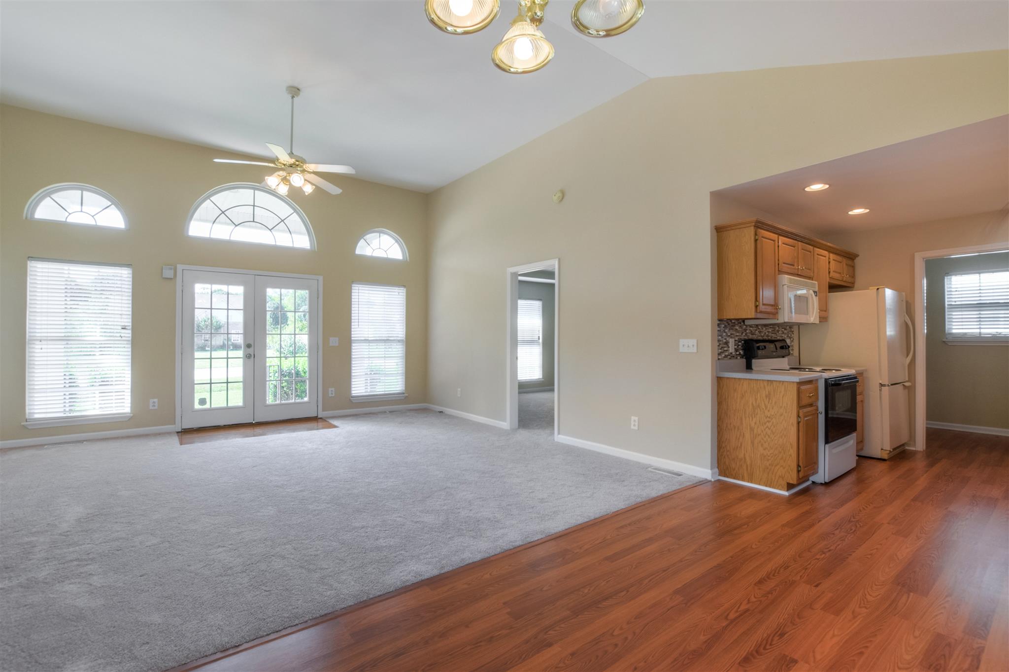 516 Windy Road Mount Juliet, TN 37122 - Photo 7 of 30 a view of an empty room with window and wooden floor