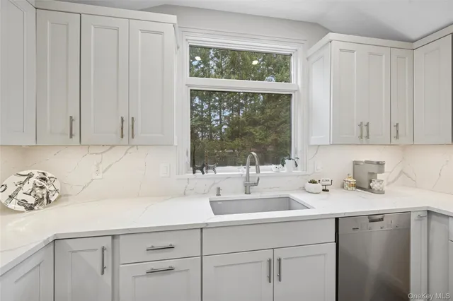 a bathroom with a sink and a window