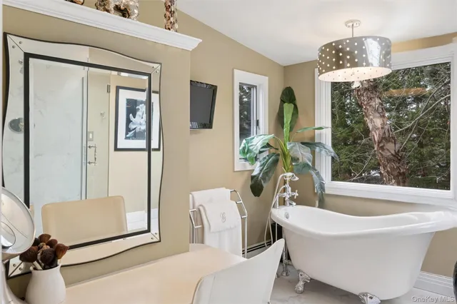 a white bath tub sitting next to a white tub