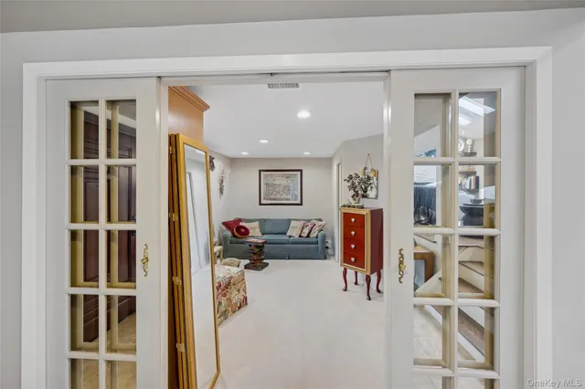a bathroom with a granite countertop sink a mirror and shower