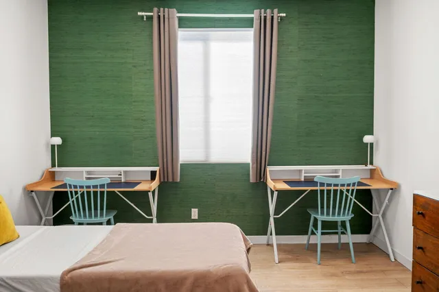 a balcony with table and chairs