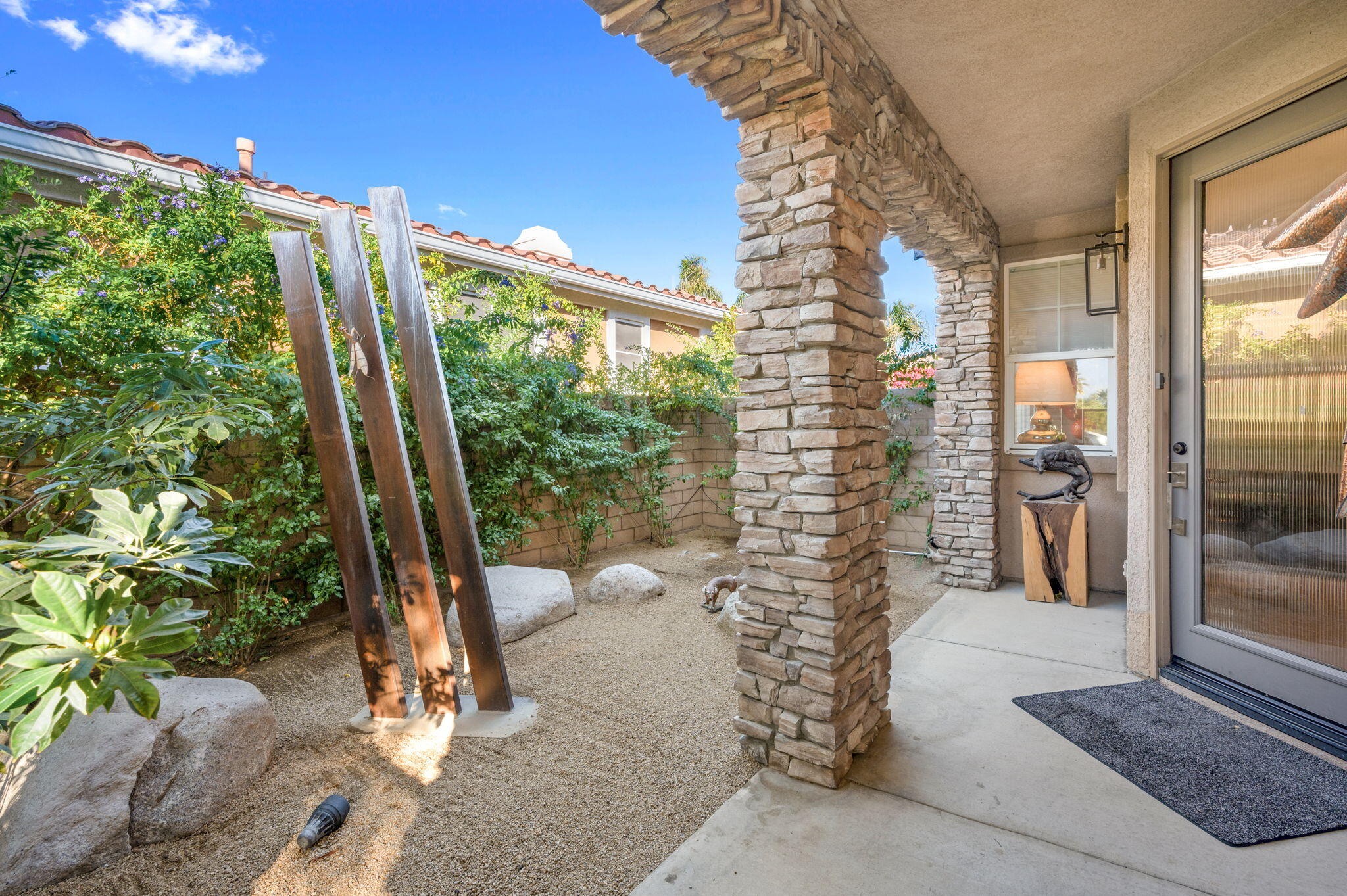 40 Shoreline Drive Rancho Mirage, CA 92270 - Photo 3 of 33 a view of a porch with a floor to ceiling window and yard