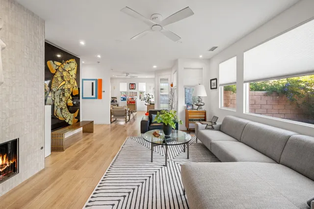 a living room with furniture and a large window