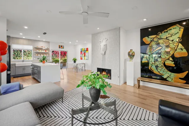 a living room with furniture and flowers