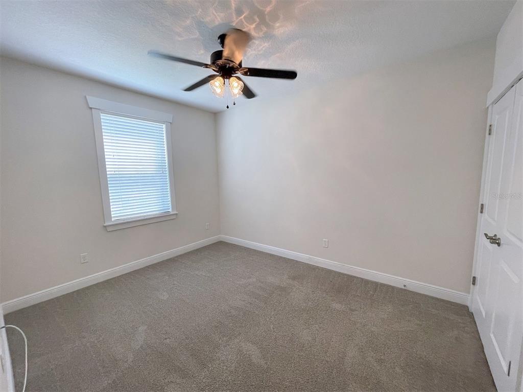 2411 West North A Street, Unit 2 Tampa, FL 33609 - Photo 11 of 19 an empty room with a window and a fan