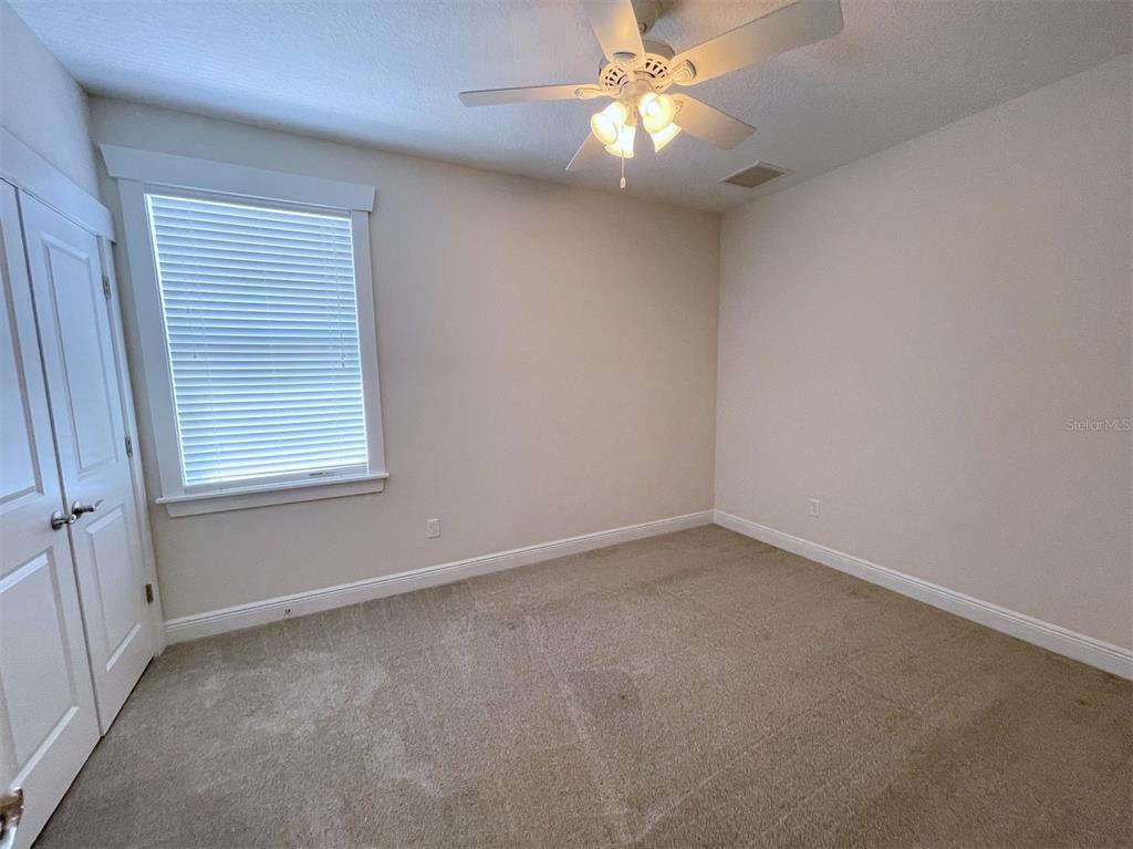 2411 West North A Street, Unit 2 Tampa, FL 33609 - Photo 13 of 19 an empty room with a window and a fan