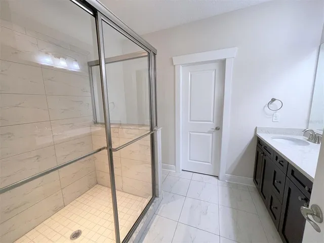 a bathroom with a bathtub and a sink