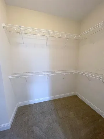 a view of a room with racks on the wall
