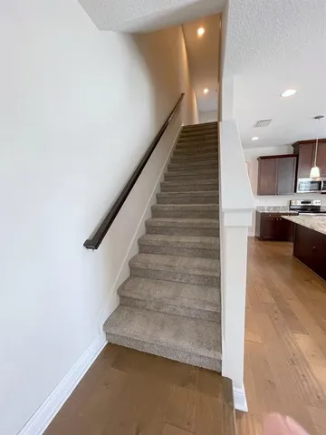 a view of entryway and kitchen