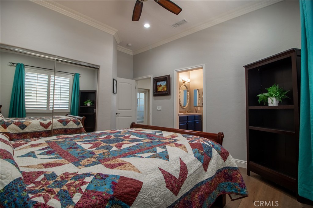 33699 Spring Brook Circle Temecula, CA 92592 - Photo 73 of 83 a bedroom with a bed and a walk in closet