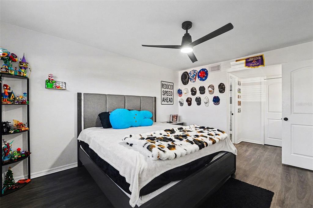 5197 Silent Loop, Unit 121 New Port Richey, FL 34652 - Photo 12 of 36 a bedroom with a bed and a large window