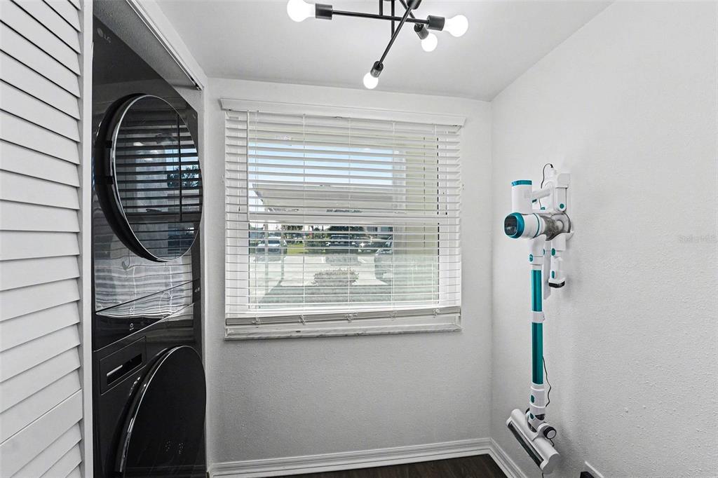 5197 Silent Loop, Unit 121 New Port Richey, FL 34652 - Photo 19 of 36 a view of hallway with wooden floor