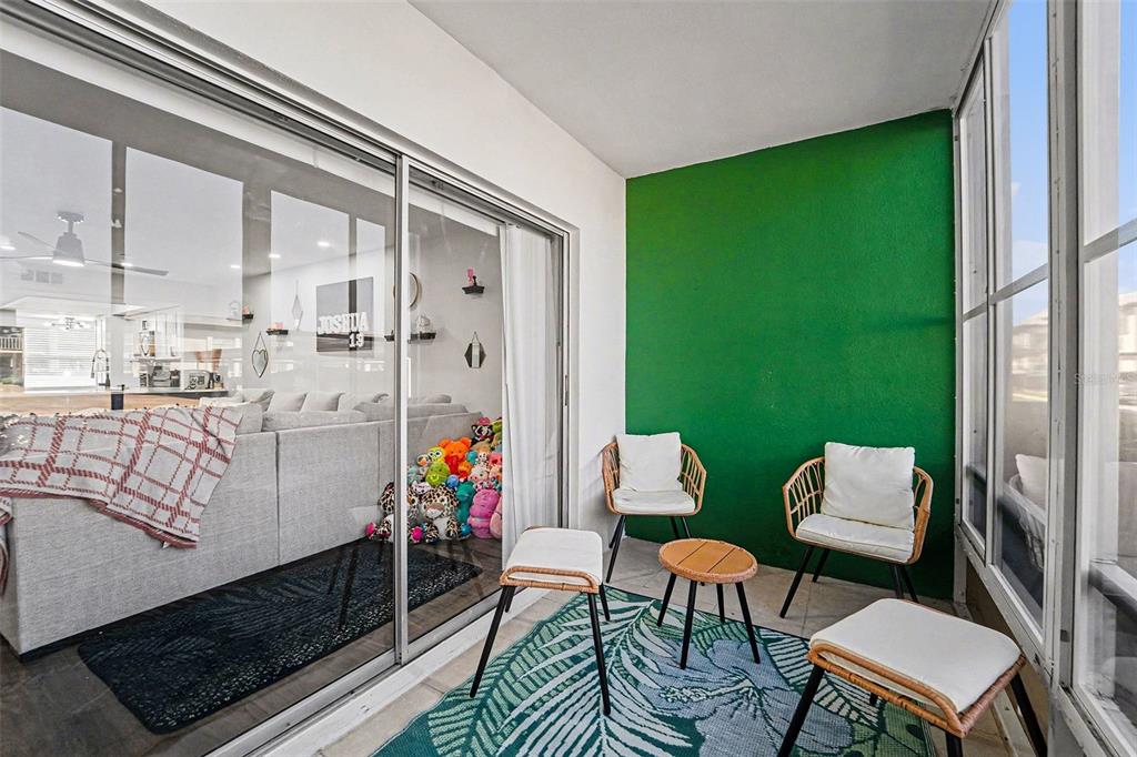 5197 Silent Loop, Unit 121 New Port Richey, FL 34652 - Photo 20 of 36 a room with furniture and a large window