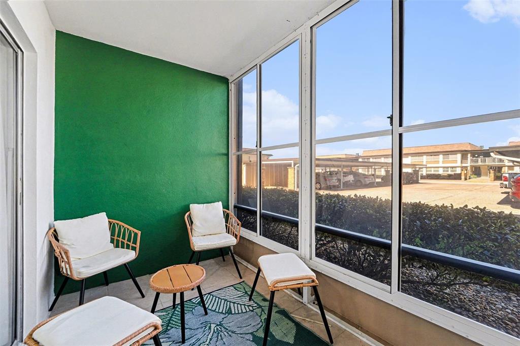 5197 Silent Loop, Unit 121 New Port Richey, FL 34652 - Photo 21 of 36 a view of a chairs in balcony