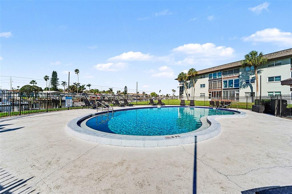 5197 Silent Loop, Unit 121 New Port Richey, FL 34652 - Photo 24 of 36 a view of a house with a swimming pool