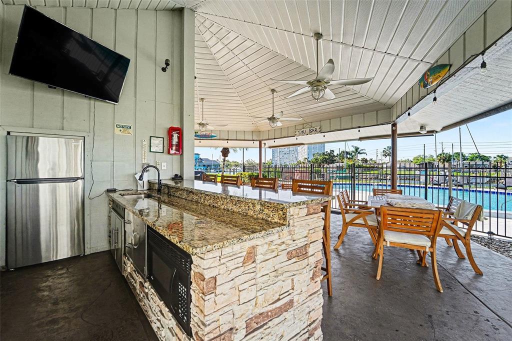 5197 Silent Loop, Unit 121 New Port Richey, FL 34652 - Photo 25 of 36 a view of a chairs and table in a patio