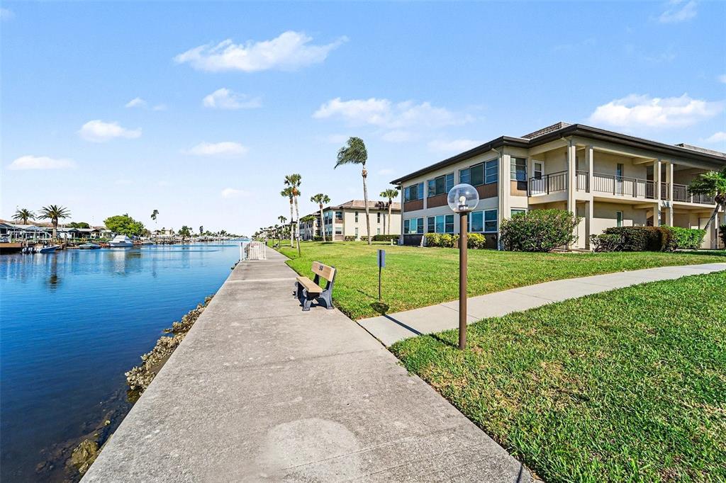 5197 Silent Loop, Unit 121 New Port Richey, FL 34652 - Photo 26 of 36 a view of a house next to a yard with big trees