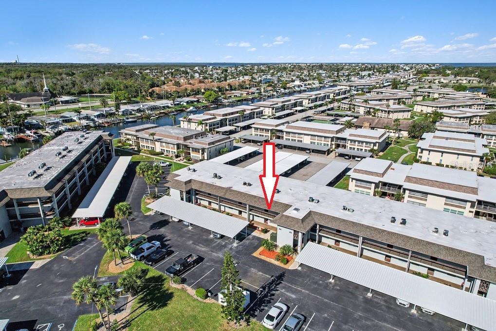 5197 Silent Loop, Unit 121 New Port Richey, FL 34652 - Photo 31 of 36 an aerial view of a city with lots of residential buildings