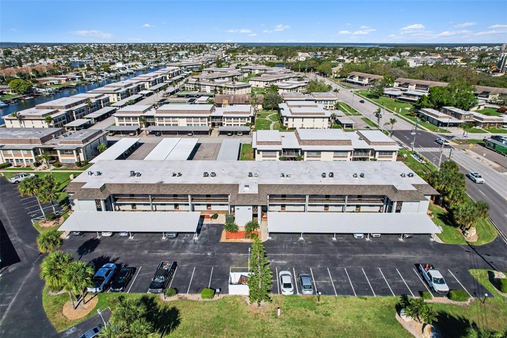 5197 Silent Loop, Unit 121 New Port Richey, FL 34652 - Photo 32 of 36 an aerial view of a large building with a yard