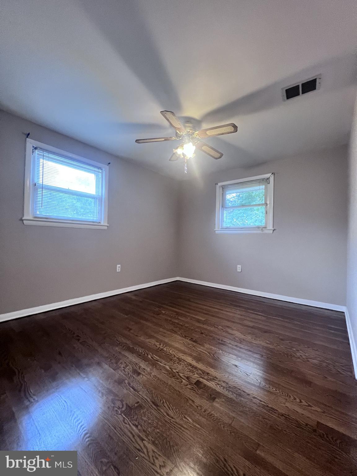 3620 Marlbrough Way College Park, MD 20740 - Photo 11 of 30 a view of an empty room with wooden floor and a window