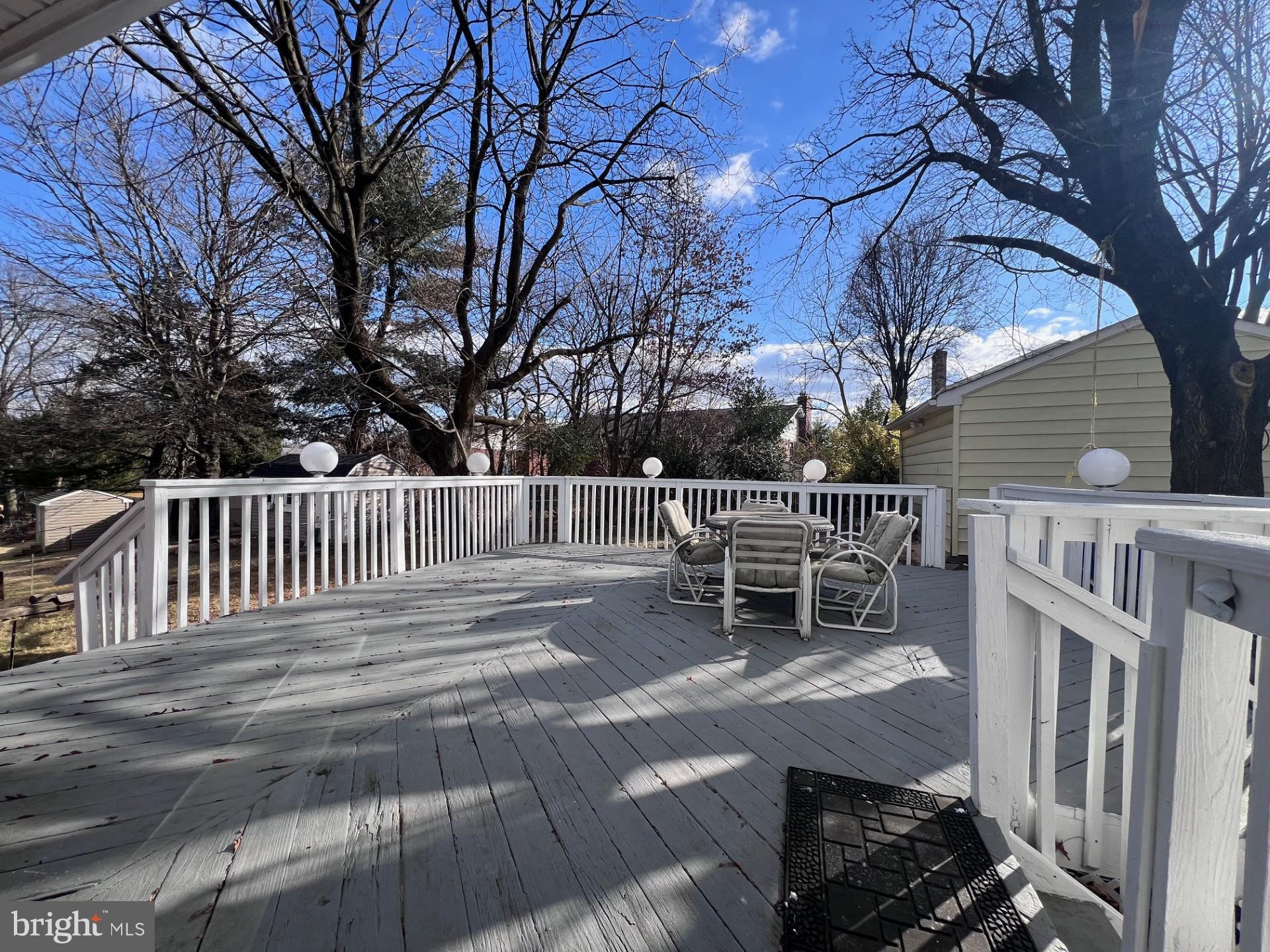 3620 Marlbrough Way College Park, MD 20740 - Photo 28 of 30 a wooden bench sitting in front of house