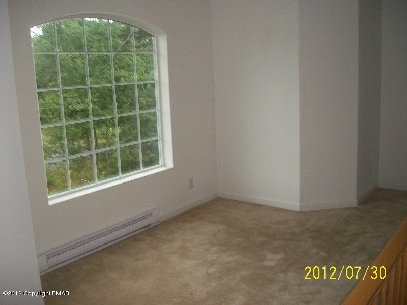 162 Stonecrest Road Blakeslee, PA 18610 - Photo 6 of 15 a view of an empty room with a window