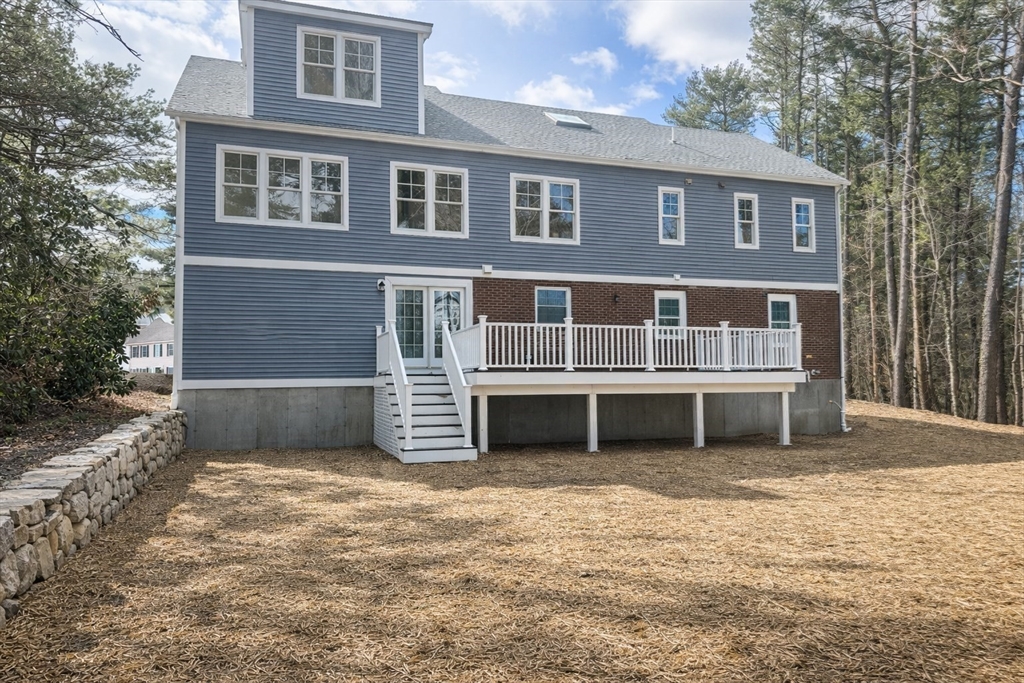 510 Common Street Walpole, MA 02081 - Photo 28 of 35 a front view of a house with a yard