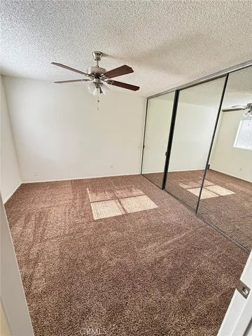 a bathroom with a double vanity sink toilet and mirror
