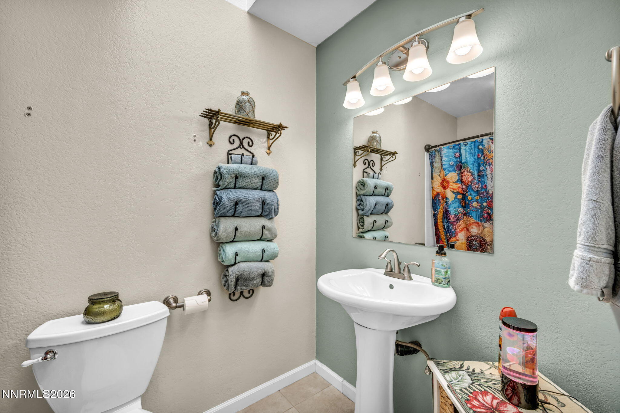 10200 Shiloh Drive Reno, NV 89508 - Photo 20 of 37 a bathroom with a sink a mirror and a toilet