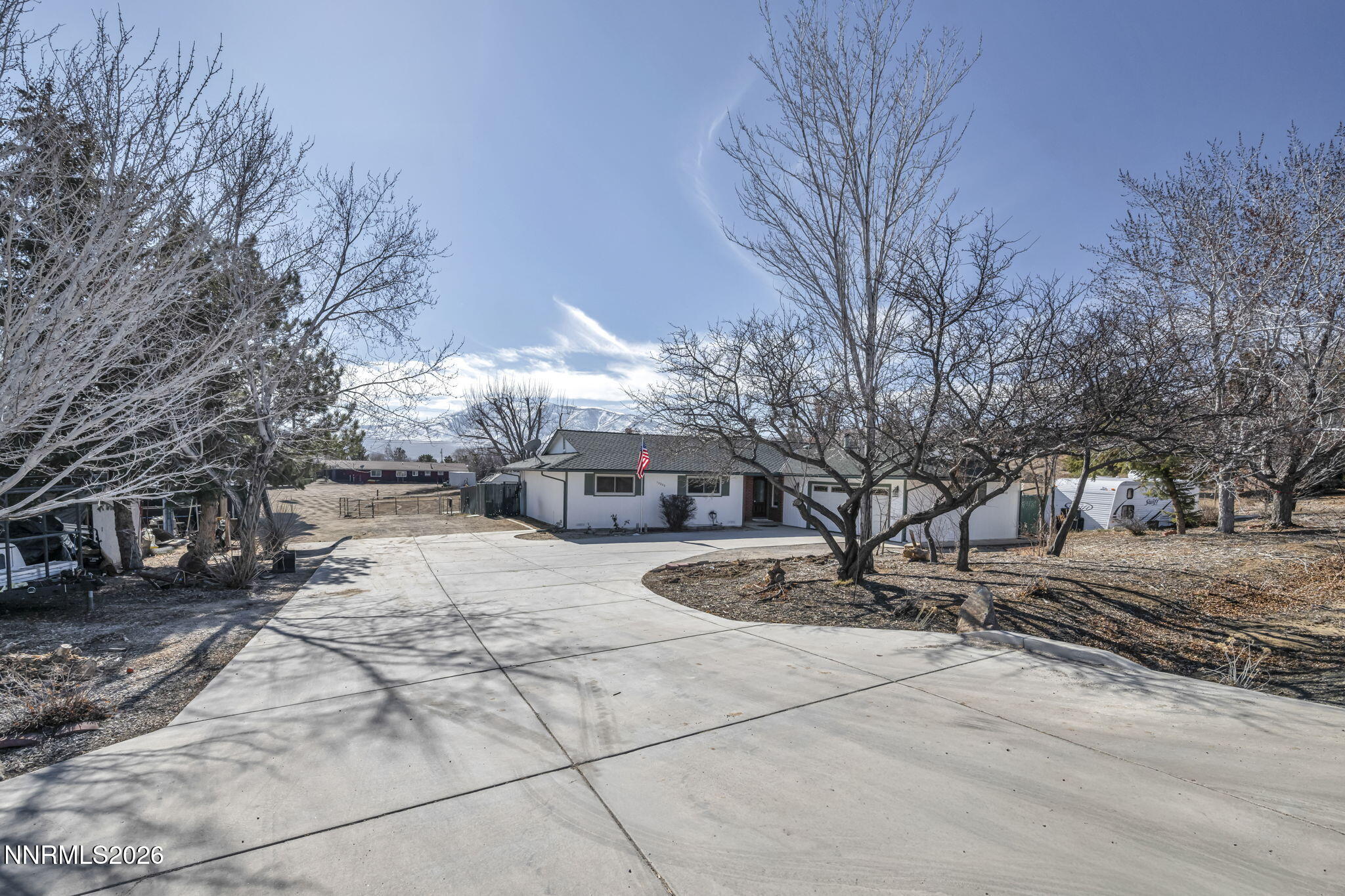 10200 Shiloh Drive Reno, NV 89508 - Photo 2 of 37 a view of a house with snow on the side of the road