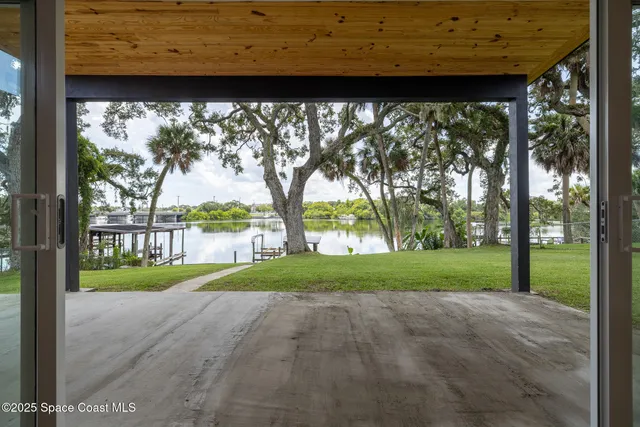 a kitchen with granite countertop and chairs