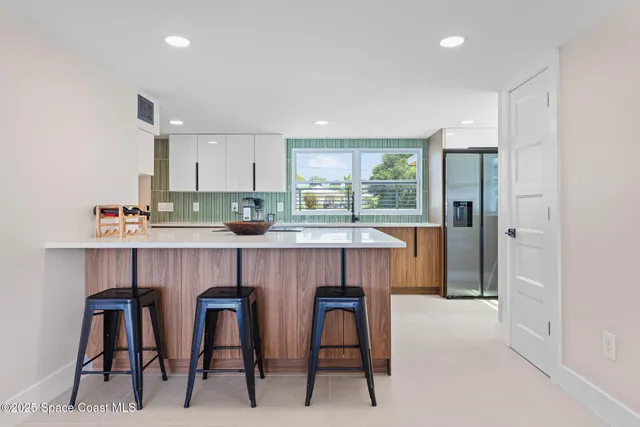 a view of living room with furniture and window
