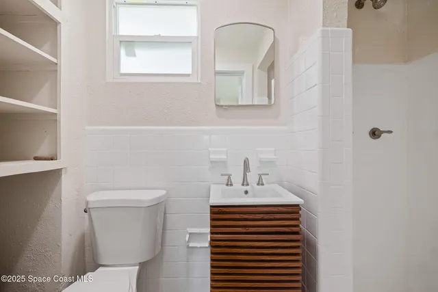 a view of a backyard with large trees