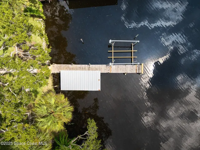 a view of a lake with boats and trees
