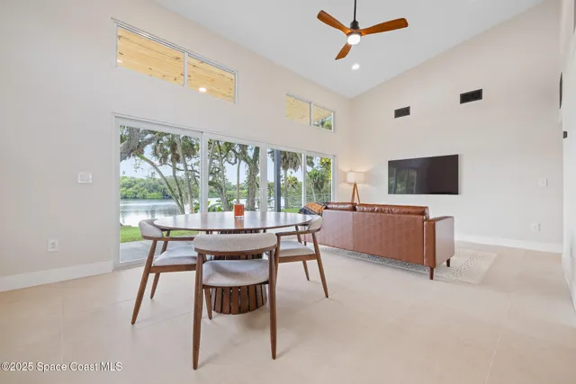 a view of a dining room with furniture window and outside view