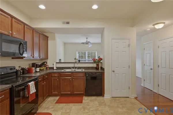 a bathroom with a toilet a sink and a mirror