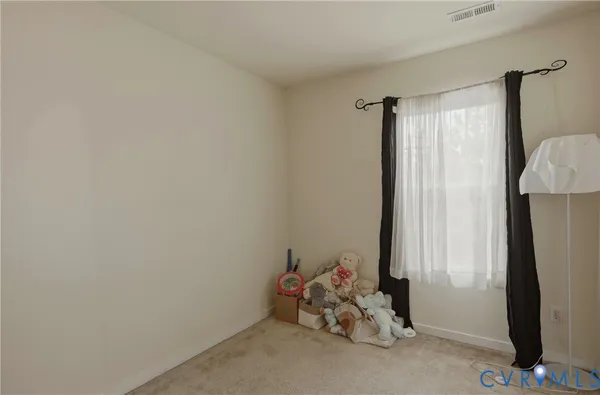 a bathroom with a shower curtain and a curtain