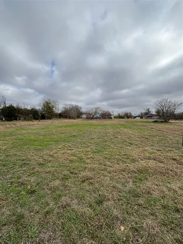 a view of a lake with a big yard