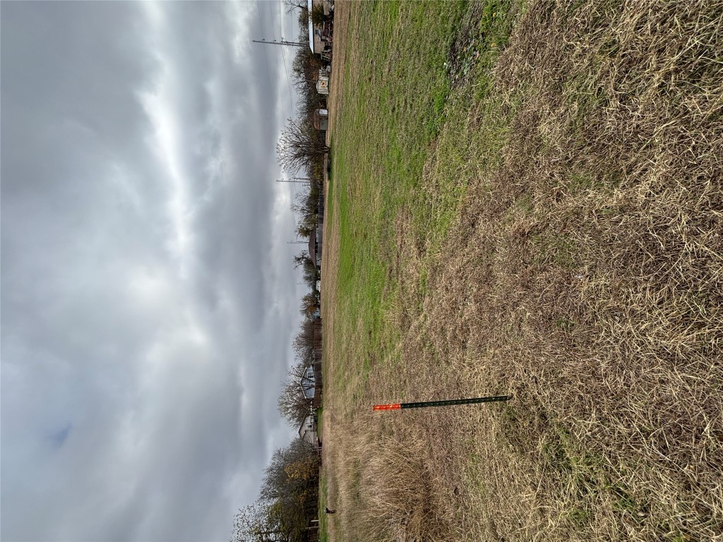 1302 Frink Street Taylor, TX 76574 - Photo 6 of 11 a view of a lake with a big yard