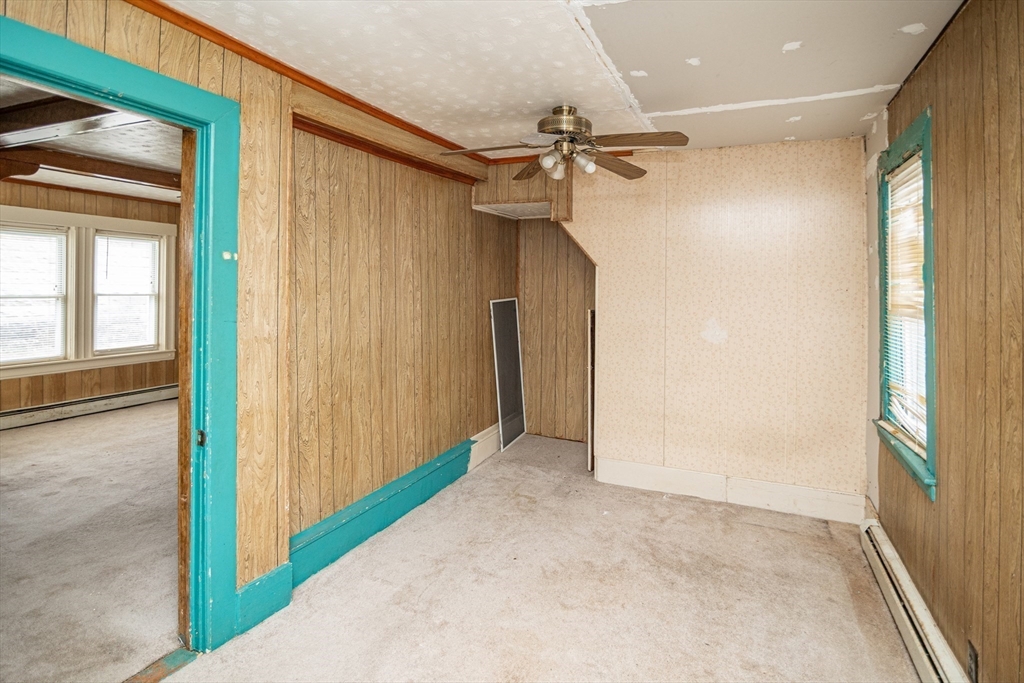 21 Park Street Webster, MA 01570 - Photo 26 of 38 a view of hallway with a ceiling fan and windows