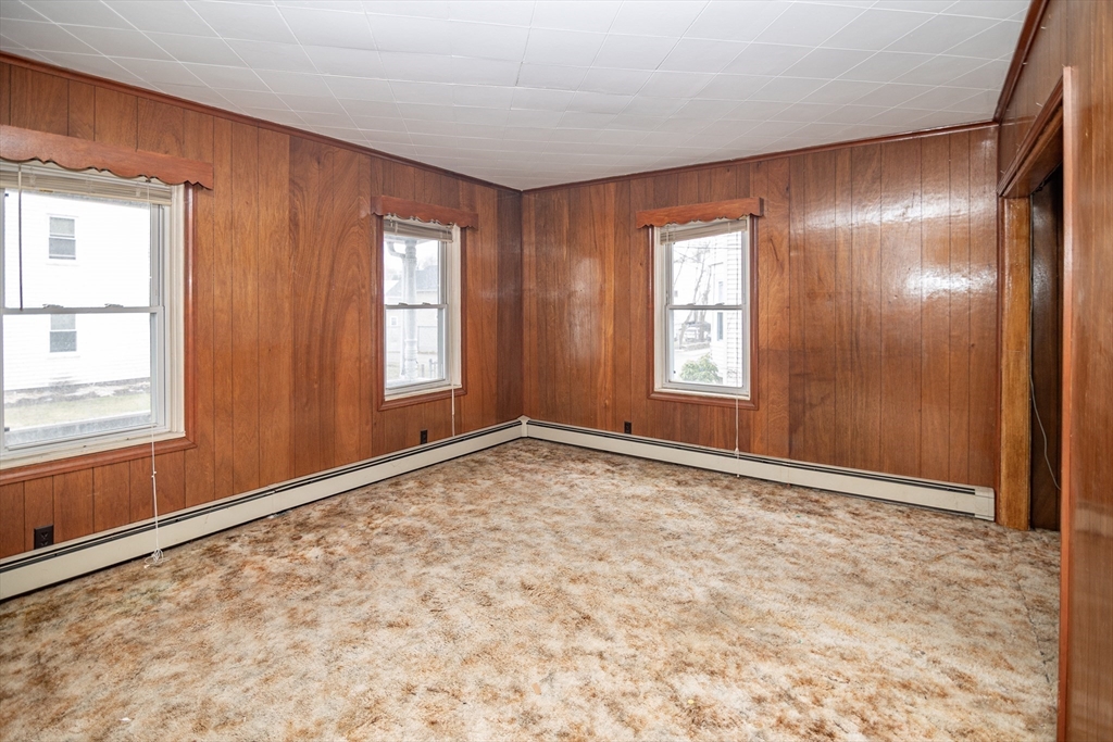 21 Park Street Webster, MA 01570 - Photo 6 of 38 a view of an empty room with window and bathroom