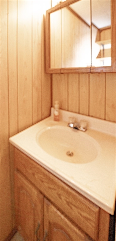 21 Park Street Webster, MA 01570 - Photo 7 of 38 a bathroom with a sink and a window